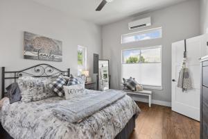 a bedroom with a large bed and a window at Griz Country Cottage in Missoula