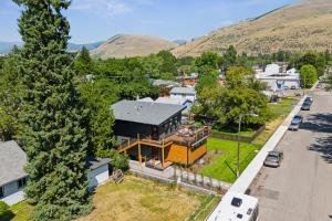 an aerial view of a house with mountains in the background at Griz Country Cottage in Missoula