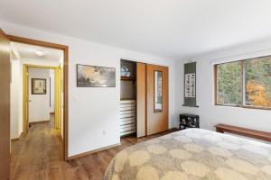 a bedroom with a large bed and a window at Close to downtown on Riverfront Park in Missoula