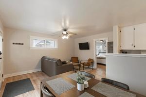 a living room with a table and a couch at Slant Streets Bungalow in Missoula