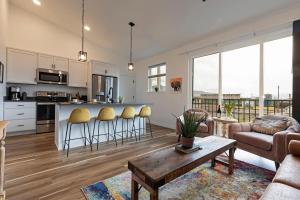 a kitchen and living room with a table and chairs at The Railway Lofts 201 in Missoula