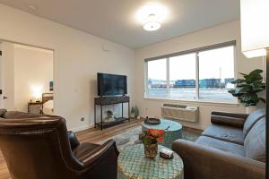 a living room with a couch and a table at The Railway Flats 101 in Missoula