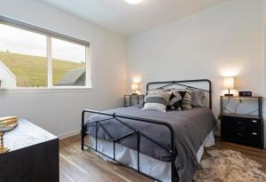 a bedroom with a bed and a large window at The Railway Lofts 202 in Missoula