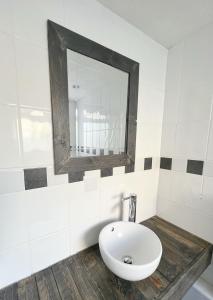 a bathroom with a white sink and a mirror at Rodney Retreat, Ramsgate Kent in Haywards Heath +21 photos