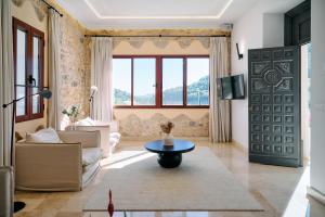 a living room with a couch and a table at YOUNG Hotels Denia in La Vall de Laguar