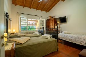 Ένα ή περισσότερα κρεβάτια σε δωμάτιο στο Agriturismo Casa Fonsi