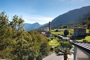 a view of a town with mountains in the background at La Terrazza Panoramica in San Sebastiano