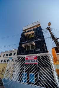 a building with solar panels on the side of it at Flat Pet Friendly prox ao Aeroporto in Fortaleza