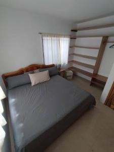 En eller flere senge i et værelse på Departamento Crucita