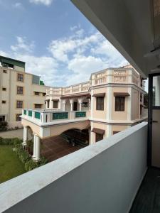 a view of a building from a balcony at The Cozy Cranny in Chennai