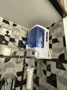 a toaster sitting on a shelf in a bathroom at The Cozy Cranny in Chennai +22 photos