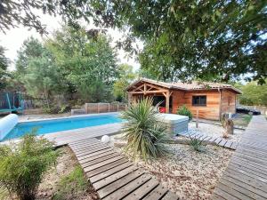 Πισίνα στο ή κοντά στο Maison bois 4 Ch Piscine & Spa proche Contis Océan