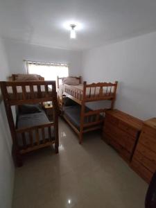 En eller flere senge i et værelse på Departamento Crucita