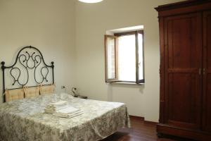 Ένα ή περισσότερα κρεβάτια σε δωμάτιο στο Agriturismo Il Cerrone