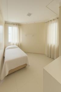 Ένα ή περισσότερα κρεβάτια σε δωμάτιο στο Luxury Residence for Rent for COP30 - Villa Firenze +15 φωτογραφίες