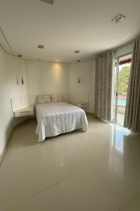 Ένα ή περισσότερα κρεβάτια σε δωμάτιο στο Luxury Residence for Rent for COP30 - Villa Firenze