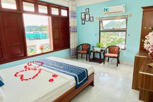 Ένα ή περισσότερα κρεβάτια σε δωμάτιο στο Phoenix Flower Hotel & Travel +92 φωτογραφίες