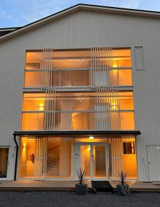 a large building with large windows on the side of it at Marina Resort A8 in Kalajoki