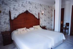 Postel nebo postele na pokoji v ubytování Hotel Playa de Regla