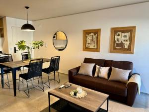 a living room with a couch and a table at Rent a Flat Nueva Cordoba in Cordoba