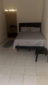 En eller flere senge i et værelse på casa de eventos mangabeira