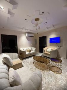 a large living room with couches and a tv at شقق رومكس Rumex apartments in Al-Salam +24 photos
