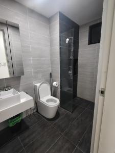 a bathroom with a toilet and a sink and a shower at Trion Residence Kuala Lumpur by Centrix in Kuala Lumpur
