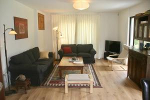 a living room with a couch and a coffee table at Hisa Smast in Kobarid