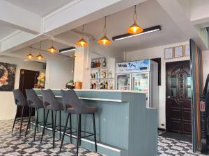 a bar in a restaurant with bar stools at Sherly 888 Hotel in Hua Hin +22 photos