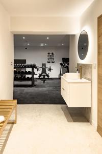 a bathroom with a sink and a mirror at La Louvière in Villard-de-Lans