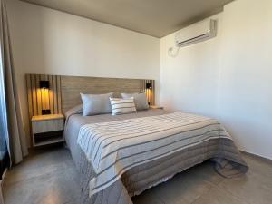 a bedroom with a large bed in a room at Rent a Flat Nueva Cordoba in Cordoba +38 photos