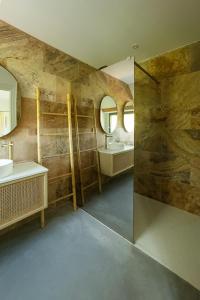 a bathroom with two sinks and a shower with mirrors at La Louvière in Villard-de-Lans +103 photos