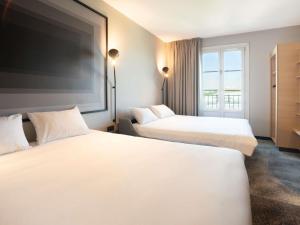 Postel nebo postele na pokoji v ubytování ibis Strasbourg Centre Gare