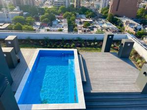 a swimming pool on the roof of a building at Rent a Flat Nueva Cordoba in Cordoba