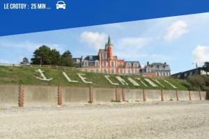 a view of a large building on a hill at La Sucrerie - Charme Industriel RDC in Abbeville