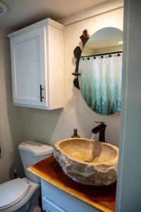a bathroom with a sink and a toilet at Creekside Gem, Hot Tub, Sleeping Porch, Fire Pit in Mentone +61 photos