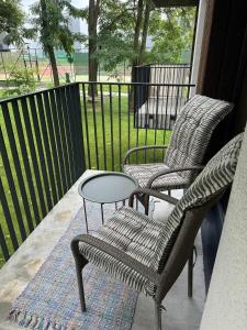 two chairs and a table on a porch at Holiday home in Birstonas in Birštonas