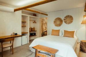 Postel nebo postele na pokoji v ubytování Kalit Hotel