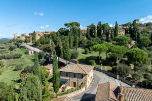 an aerial view of a village with houses and trees at Maria Gabriella Holiday Home In Monticchiello in Monticchiello