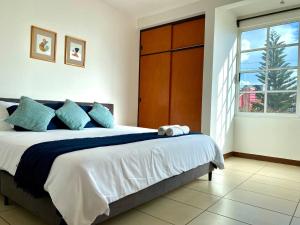 Ένα ή περισσότερα κρεβάτια σε δωμάτιο στο Family Size - 4BR House in Oaxaca - Peaceful