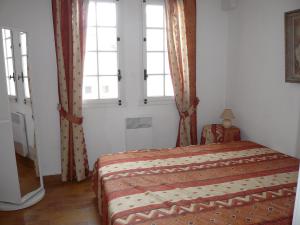 เตียงในห้องที่ Apartment Hameau la Madrague.13