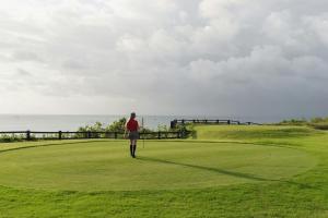 a person walking on a golf course at Mariposa in El Médano