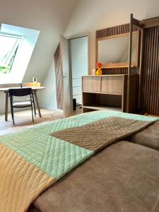 a bedroom with a bed with a mirror and a desk at BunnyHuus Scheunen-Loft in Oberndorf