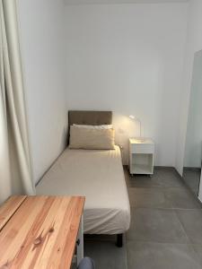 Postel nebo postele na pokoji v ubytování playa honda airport suite