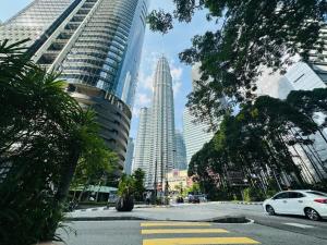 a view of a city with tall buildings at Luxury Suites Twin Tower in Kuala Lumpur