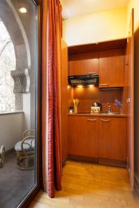 a kitchen with wooden cabinets and a counter top at Apartment KeyGo #0035 is the key to the center of Yerevan in Yerevan