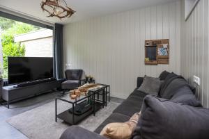 โทรทัศน์และ/หรือระบบความบันเทิงของ Veluwe Nature Cottage for 2 people I Luxury kitchen