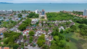 an aerial view of a residential neighborhood with houses at Sorrento Pool Villa Naga Jomtien Pattaya in Na Jomtien
