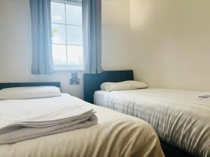 Ένα ή περισσότερα κρεβάτια σε δωμάτιο στο North Devon Resort +9 φωτογραφίες