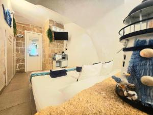 En eller flere senge i et værelse på La casetta del marinaio